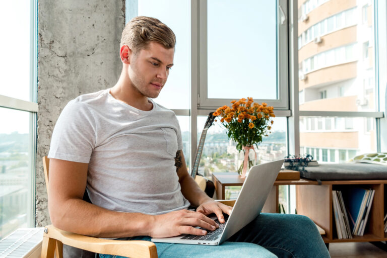 Entrepreneur on his laptop working on form 5472.