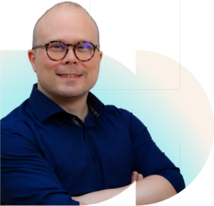 Smiling male tax specialist with glasses and shaved head.